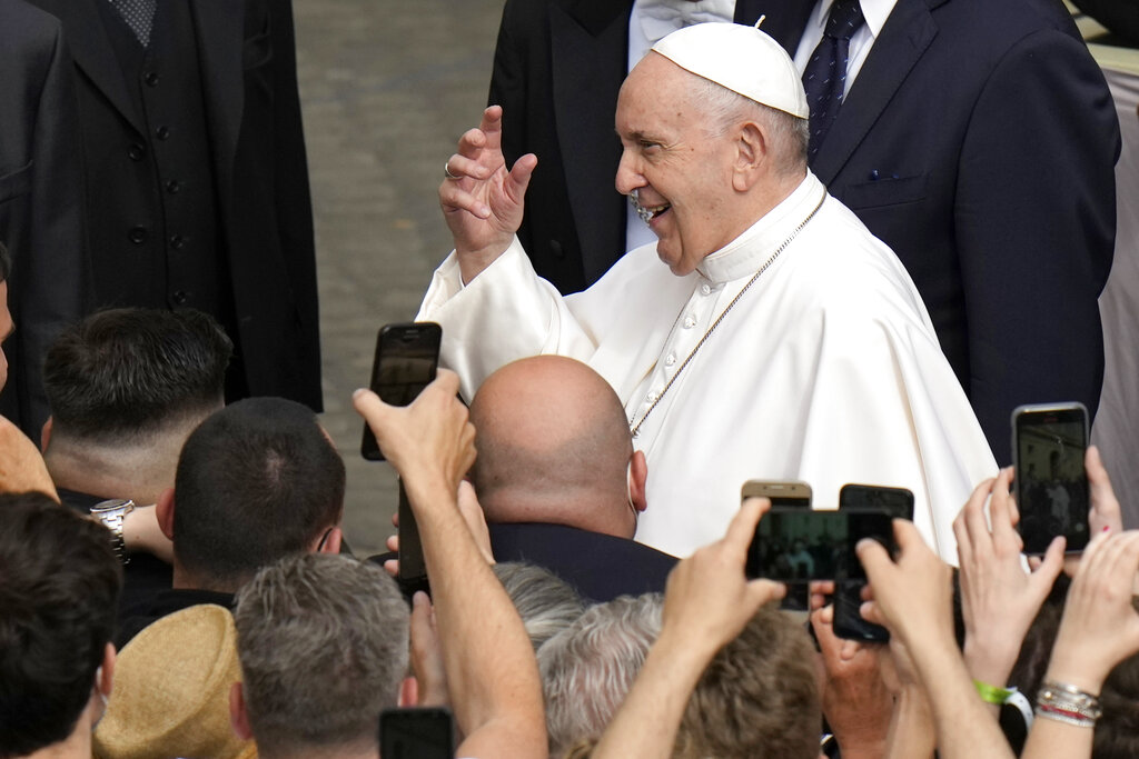 Pope Francis is cheered by faithful as he arrives for his weekly general audience, at the Vatican, Wednesday, June 9, 2021. (AP Photo/Alessandra Tarantino)