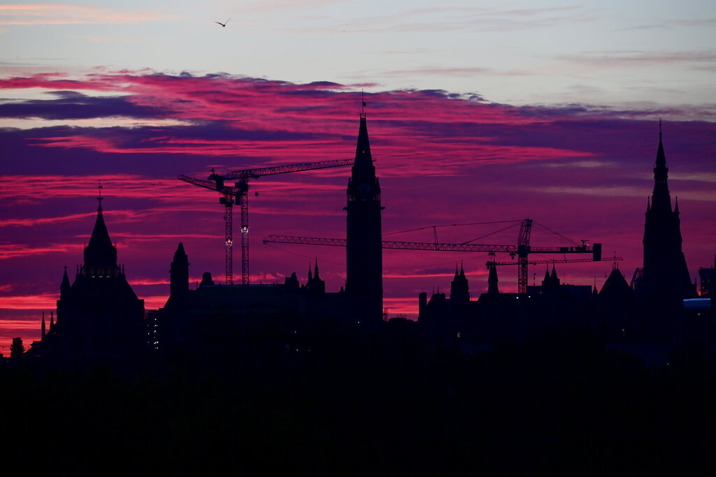 Sunrise over Parliament Hill in Ottawa on Thursday, June 10, 2021.  (Sean Kilpatrick/The Canadian Press via AP)