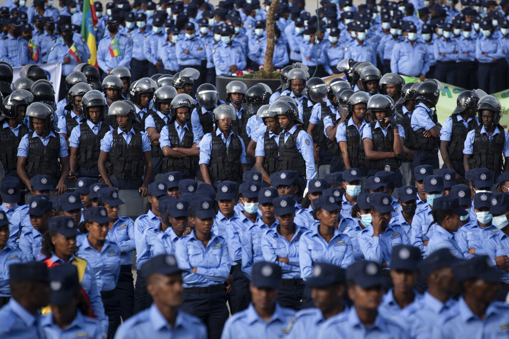 Ethiopian police attend a parade to display new police uniforms and instruct them to maintain impartiality and respect the law during the upcoming election, in Meskel Square in downtown Addis Ababa, Ethiopia Saturday, June 19, 2021. The country is due to vote in a general election on Monday, June, 21, 2021, the centerpiece of a reform drive by Prime Minister Abiy Ahmed. (AP Photo/Ben Curtis)