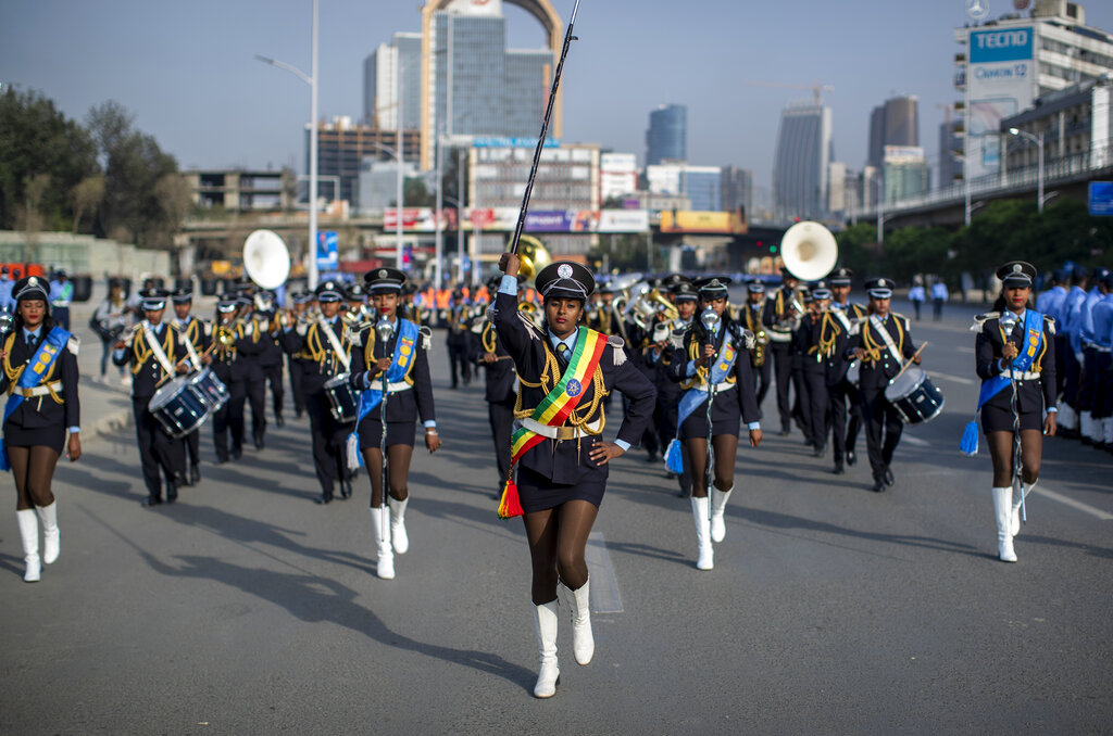 An Ethiopian police band marches at a parade to display new police uniforms and instruct them to maintain impartiality and respect the law during the upcoming election, in Meskel Square in downtown Addis Ababa, Ethiopia Saturday, June 19, 2021. The country is due to vote in a general election on Monday, June, 21, 2021, the centerpiece of a reform drive by Prime Minister Abiy Ahmed. (AP Photo/Ben Curtis)