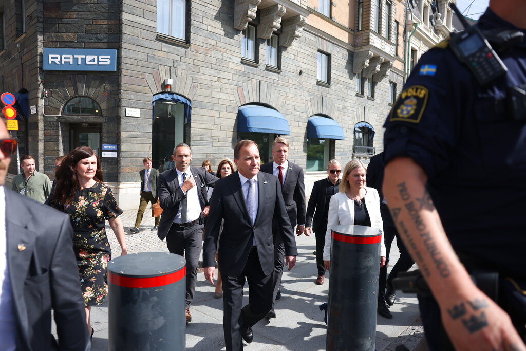 Sweden's Prime Minister Stefan Lofven, centre, before a confidence vote, with Minister for Gender Equality and Housing Marta Stenevi, left, and Minister for Finance Magdalena Andersson, right, as they arrive at the Swedish Parliament in Stockholm, Sweden, Monday June 21, 2021. Sweden's Prime Minister Stefan Lofven faces a no-confidence vote in the Riksdag parliament, after the Left Party said this week that it had lost confidence in Lofven and his center-left minority government. (Nils Petter Nilsson / TT via AP)