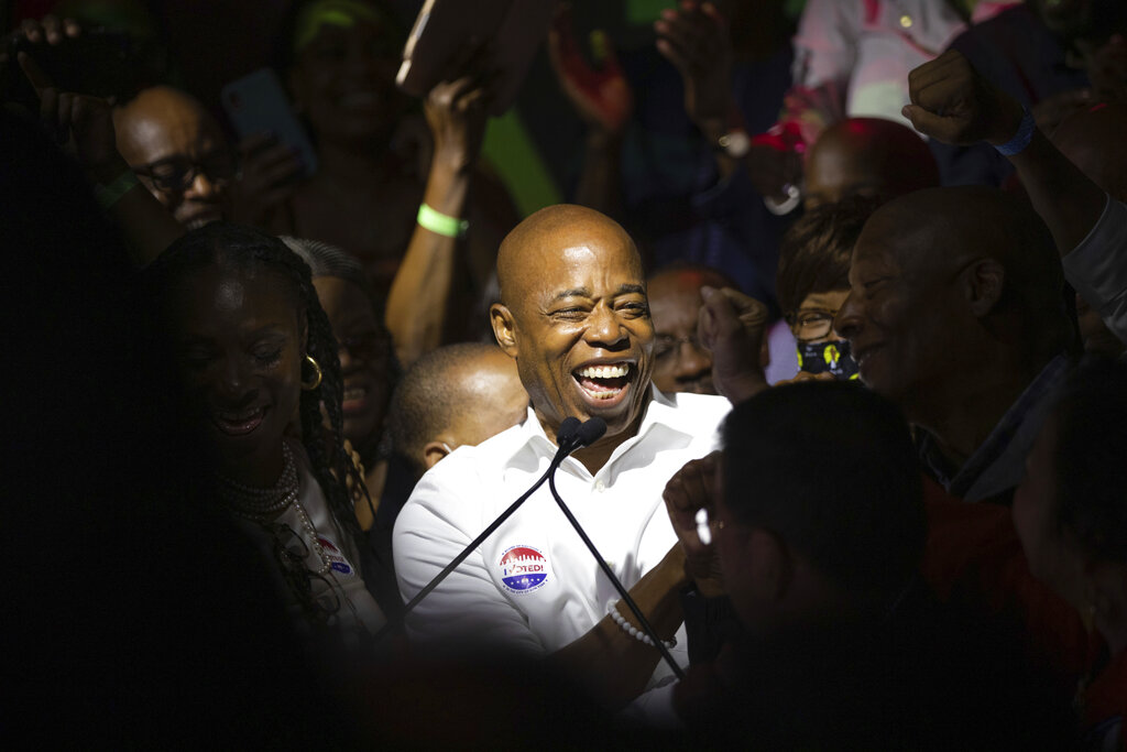 Mayoral candidate Eric Adams mingles with supporters during his election night party, late Tuesday, June 22, 2021, in New York. (AP Photo/Kevin Hagen)