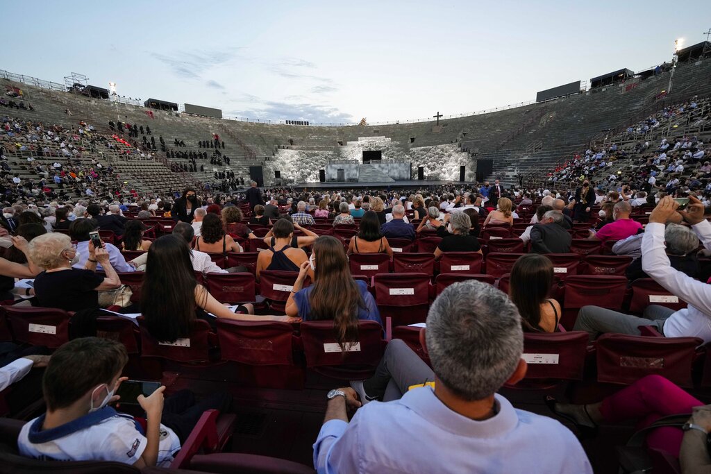 A view of the stage during 'Cavalleria Rusticana' lyric opera, at the Arena di Verona theatre, in Verona, Italy, Friday, June 25, 2021. The Verona Arena amphitheater returns to staging full operas for the first time since the pandemic struck but with one big difference. Gone are the monumental sets that project the scene to even nosebleed seats in the Roman-era amphitheater, replaced by huge LED screens with dynamic, 3D sets that are bringing new technological experiences to the opera world. (AP Photo/Luca Bruno)