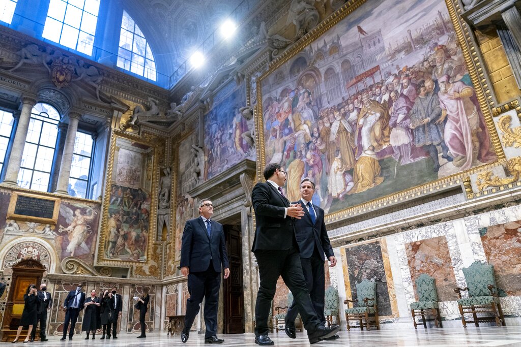 Secretary of State Antony Blinken, right, accompanied by tour guide Alessandro Conforti, second from right, and Chargé d'Affaires of the U.S. Embassy to the Holy See Patrick Connell, left, gets a tour of the Sala Regia at the Vatican in Rome, Monday, June 28, 2021. Blinken is on a week long trip in Europe traveling to Germany, France and Italy. (AP Photo/Andrew Harnik, Pool)