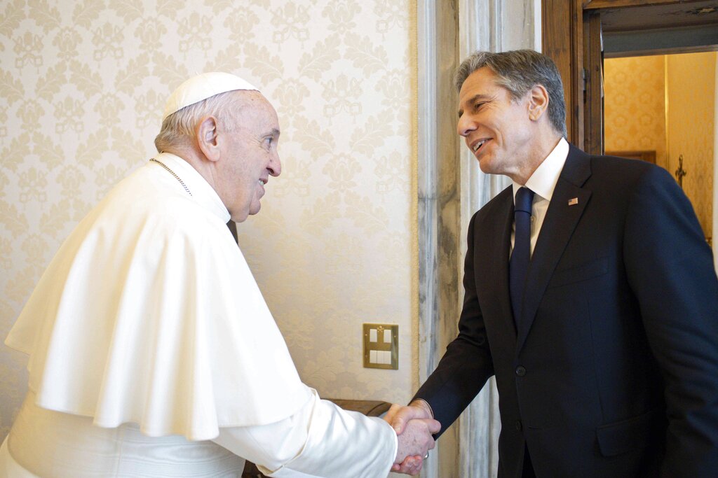Pope Francis shakes hands with Secretary of State Antony Blinken, as they meet at the Vatican, Monday, June 28, 2021. Blinken is on a week long trip in Europe traveling to Germany, France and Italy. (Vatican Media via AP Photo)