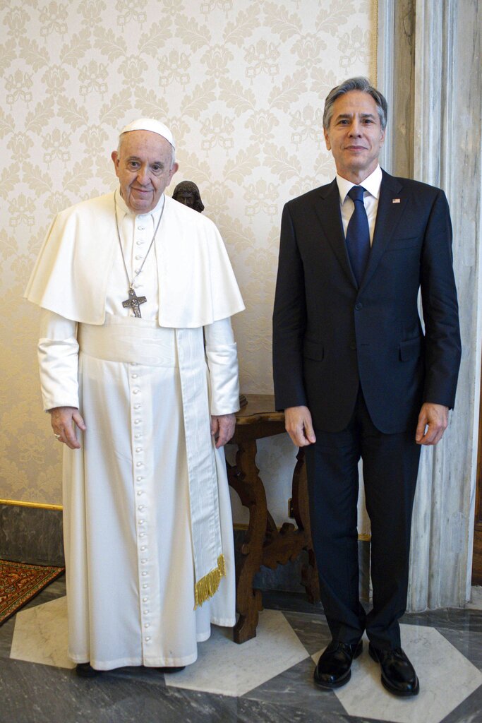 Pope Francis poses with Secretary of State Antony Blinken, as they meet at the Vatican, Monday, June 28, 2021. Blinken is on a week long trip in Europe traveling to Germany, France and Italy. (Vatican Media via AP Photo)