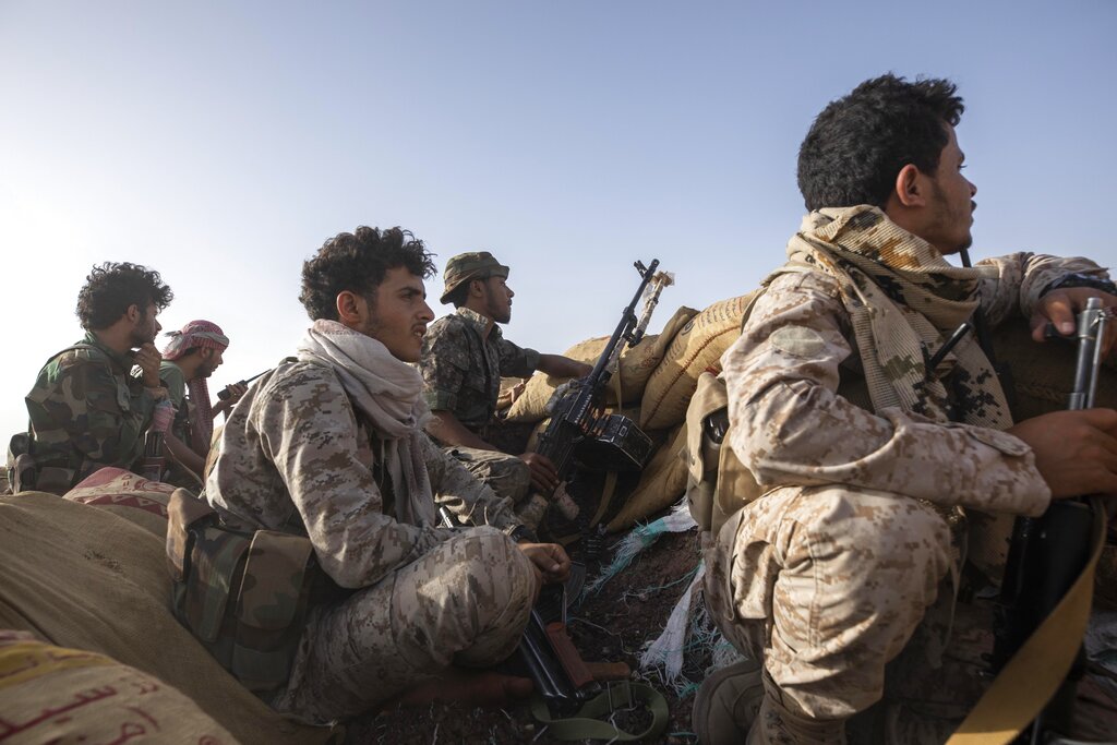Yemeni fighters backed by the Saudi-led coalition prepare for clashes with Houthi rebels on the Kassara frontline near Marib, Yemen, Sunday, June 20, 2021. (AP Photo/Nariman El-Mofty)