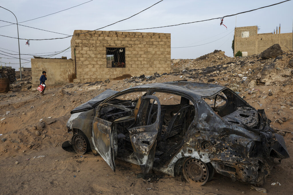 The damaged car belonging to 32-year-old Taher Farag and his two-year-old daughter Liyan Taher, who were both killed on June 5, 2021 from a ballistic missile and an explosive-laden drone fired by Yemen's Houthi rebels hitting a fuel station in the Rawdha neighborhood of the central city of Marib, Yemen, Sunday, June 20, 2021. (AP Photo/Nariman El-Mofty)