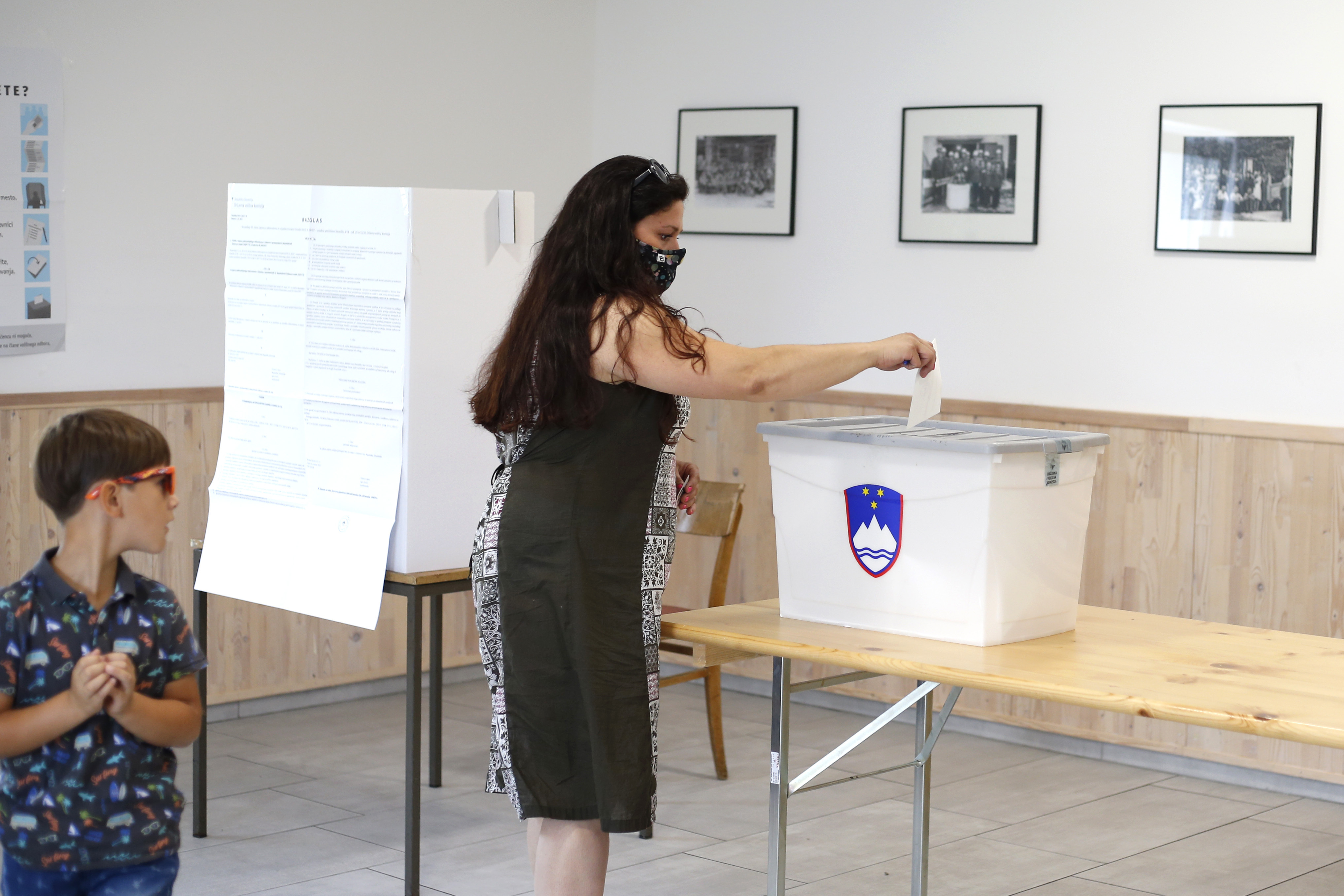 A voter casts her ballot at a polling station in Ravenska vas, Slovenia, Sunday, July 11, 2021. Slovenians voted in a referendum on changes to the country’s waters management law that is seen as a test for the government of right-wing Prime Minister Janez Jansa. Jansa’s government approved the amendments in March but ecologists have pushed through the referendum saying they threaten the environment by paving the way for construction by the sea, rivers and lakes. (AP Photo)