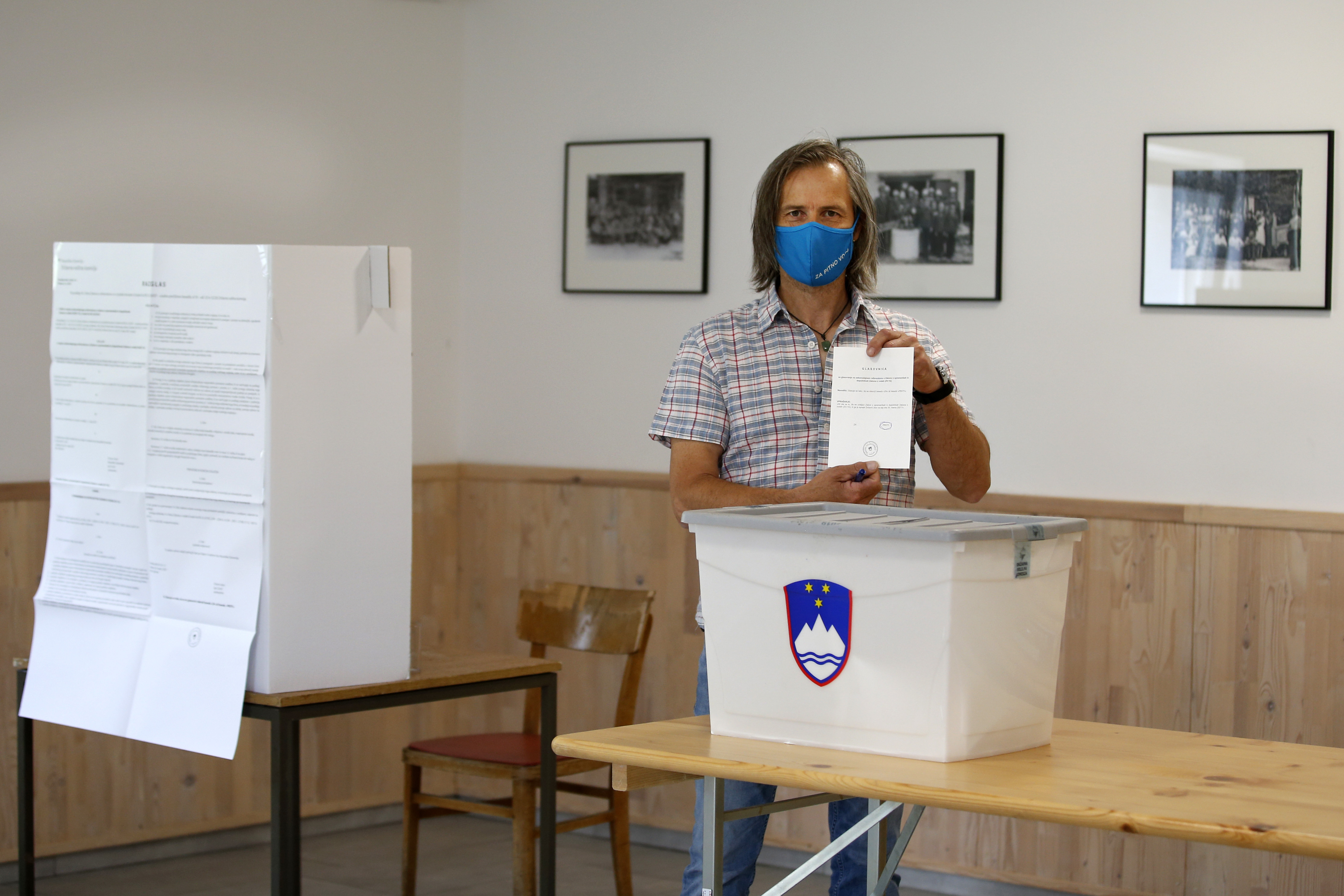 Uros Macerl, organic farmer and environmental activist casts his ballot at a polling station in Ravenska vas, Slovenia, Sunday, July 11, 2021. Slovenians voted in a referendum on changes to the country’s waters management law that is seen as a test for the government of right-wing Prime Minister Janez Jansa. Jansa’s government approved the amendments in March but ecologists have pushed through the referendum saying they threaten the environment by paving the way for construction by the sea, rivers and lakes. (AP Photo)