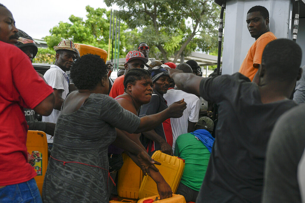 People line up to buy gasoline in Port-au-Prince, Haiti, Monday, July 12, 2021. President Jovenel Moise was assassinated on July 7. (AP Photo/Matias Delacroix)