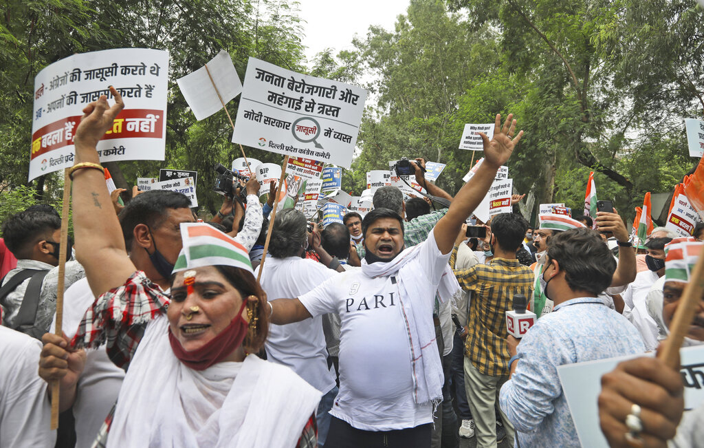 Congress party workers shout slogans during a protest accusing Prime Minister Narendra Modi’s government of using military-grade spyware to monitor political opponents, journalists and activists in New Delhi, India, Tuesday, July 20, 2021. The protests came after an investigation by a global media consortium was published on Sunday. Based on leaked targeting data, the findings provided evidence that the spyware from Israel-based NSO Group, the world’s most infamous hacker-for-hire company, was used to allegedly infiltrate devices belonging to a range of targets, including journalists, activists and political opponents in 50 countries. (AP Photo/Manish Swarup)