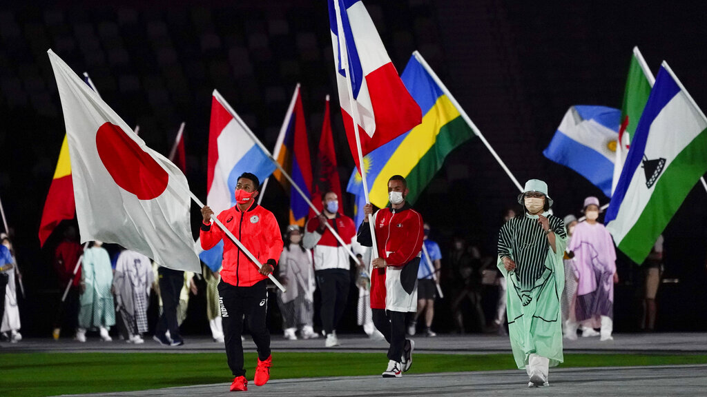 Kiyuna Ryo, of Japan, carries the flag during the closing ceremony in the Olympic Stadium at the 2020 Summer Olympics, Sunday, Aug. 8, 2021, in Tokyo, Japan. (AP Photo/Jae C. Hong)