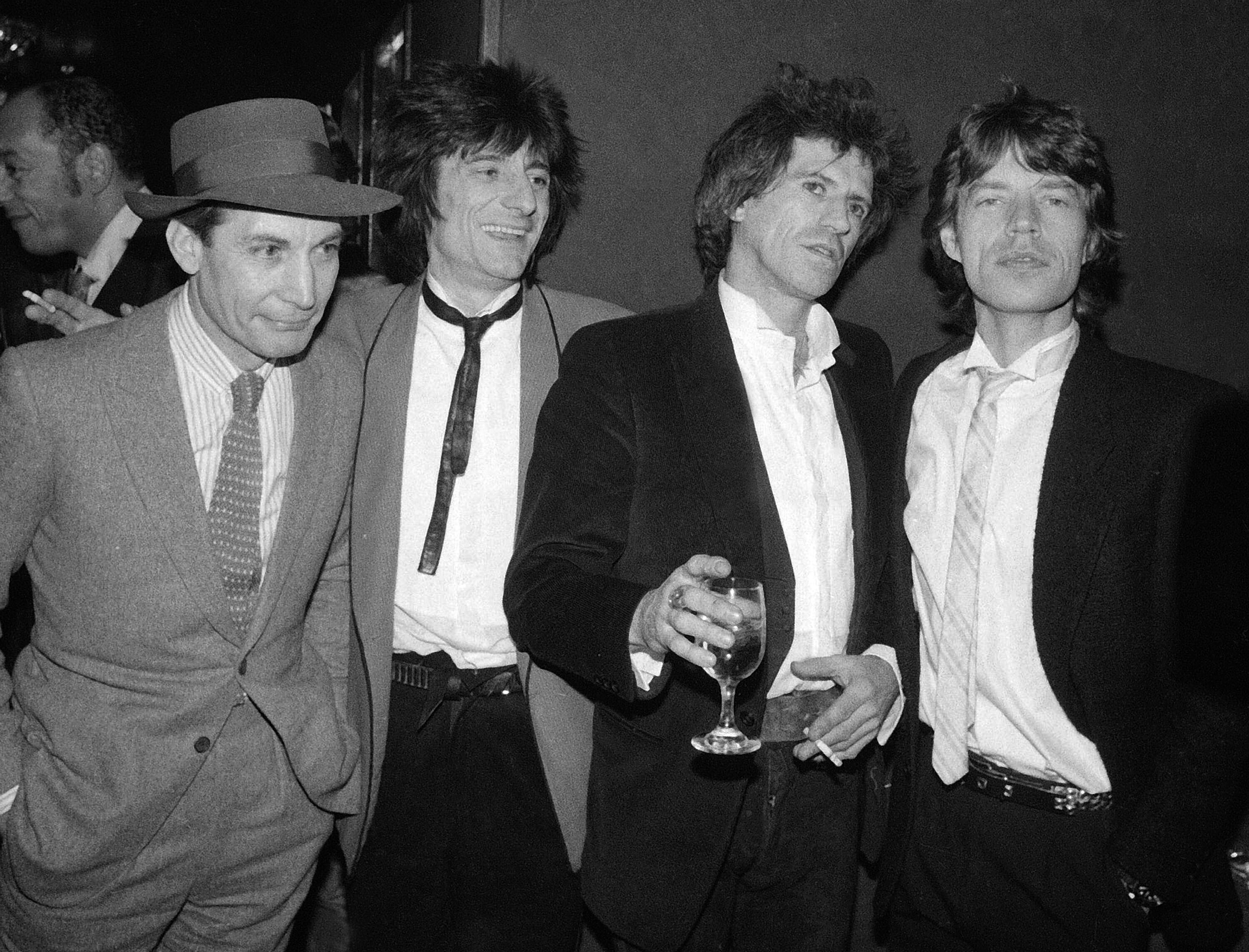 FILE - Members of the Rolling Stones, from left, Charlie Watts, Ron Wood, Keith Richards, and Mick Jagger appear at a party celebrating the opening of their film 