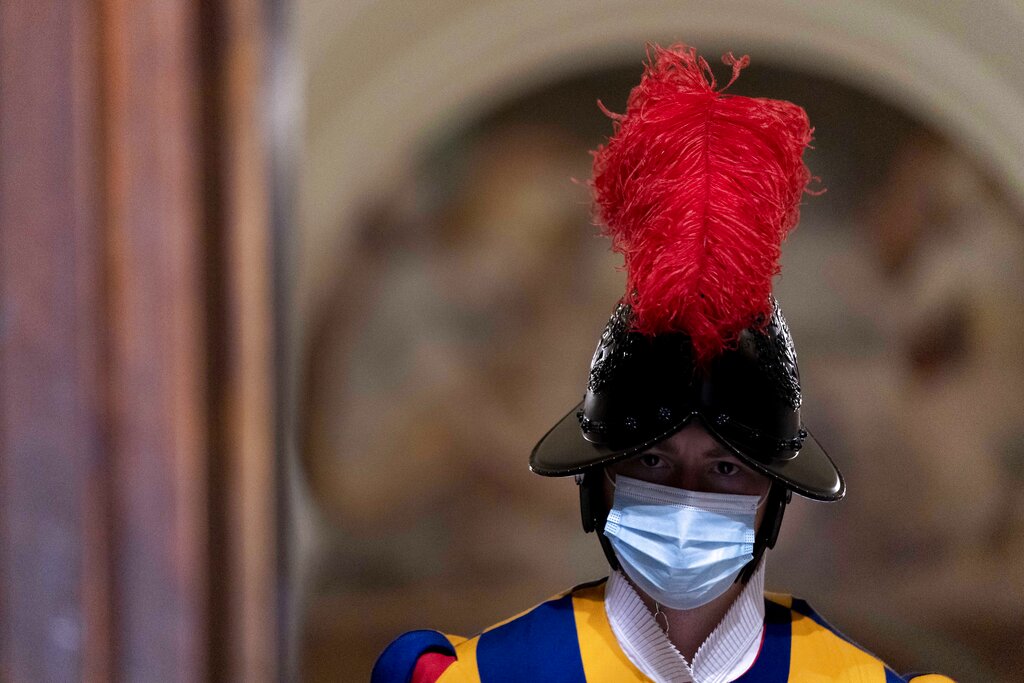 A Swiss guard stands at a doorway following a visit by Secretary of State Antony Blinken at the Vatican in Rome, Monday, June 28, 2021. Blinken is on a week long trip in Europe traveling to Germany, France and Italy. (AP Photo/Andrew Harnik, Pool)