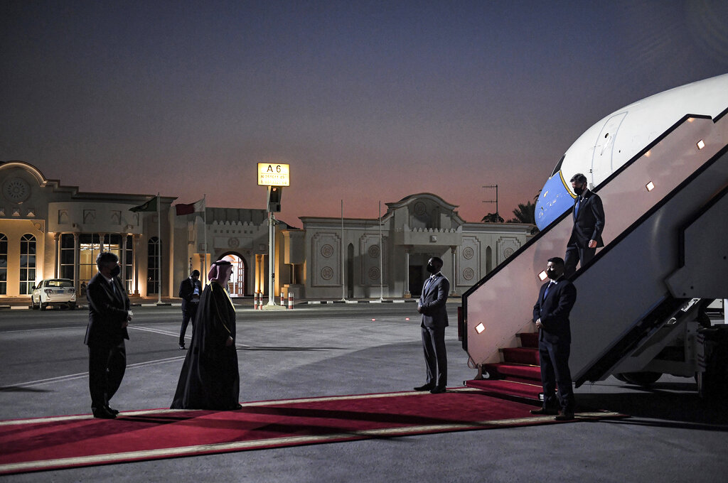 US Secretary of State Antony Blinken, right, arrives at Old Doha Airport in Qatar's capital Monday, Sept. 6, 2021. Blinken is meeting with Qatari leaders to thank the nation for its support in the Afghanistan evacuation efforts and to discuss the future of US-Afghanistan relations. (Olivier Douliery/Pool Photo via AP)