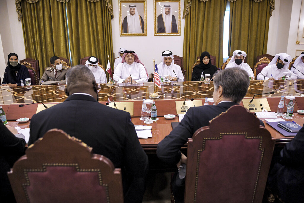 US Secretary of State Antony Blinken foreground right, and Secretary of Defense Lloyd Austin, left, take part in a meeing with Qatari Deputy Prime Minister and Foreign Minister Mohammed bin Abdulrahman Al Thani, centre right and Qatari Deputy Prime Minister and Defense Minister Dr. Khalid bin Mohammed Al-Attiyah, centre left, at the Ministry of Foreign Affairs in Doha, Qatar, Tuesday, Sept. 7, 2021. (Olivier Douliery/Pool Photo via AP)
