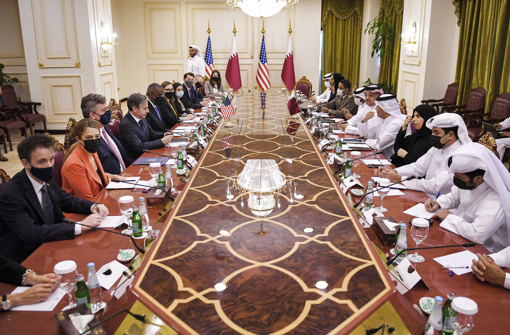 US Secretary of State Antony Blinken, fourth left and Secretary of Defense Lloyd Austin, fifth left,  takes part in a meeting with Qatari Deputy Prime Minister and Foreign Minister Mohammed bin Abdulrahman Al Thani, fourth right and Qatari Deputy Prime Minister and Defense Minister Dr. Khalid bin Mohammed Al-Attiyah, fifth right, at the Ministry of Foreign Affairs in Doha, Qatar, Tuesday, Sept. 7, 2021. (Olivier Douliery/Pool Photo via AP)