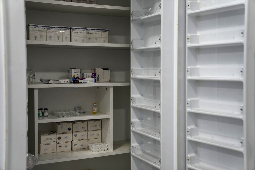 Shelves are mostly empty in the pharmacy for cancer medications inside the government-run Rafik Hariri University Hospital in Beirut, Lebanon, Wednesday, Sept. 8, 2021. Amid a devastating economic crisis, Lebanon is grappling with severe shortages of medical supplies, fuel and other necessities, threatening treatment for tens of thousands of people. (AP Photo/Hassan Ammar)