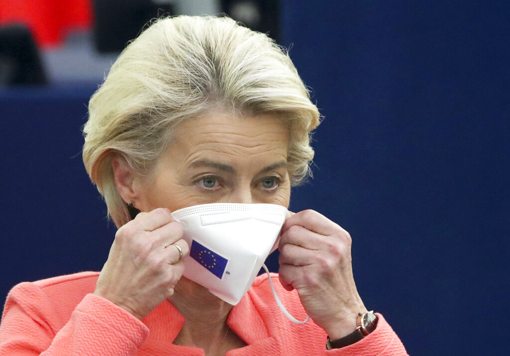 European Commission President Ursula von der Leyen puts on her protective face mask after delivering a State of the Union Address at the European Parliament in Strasbourg, France, Wednesday, Sept. 15, 2021. Stung by the swift collapse of the Afghan army and the chaotic U.S.-led evacuation through Kabul airport, the European Union on Wednesday unveiled new plans to develop its own defense capacities to try to ensure that it has more freedom to act in future crises. (Yves Herman, Pool via AP)