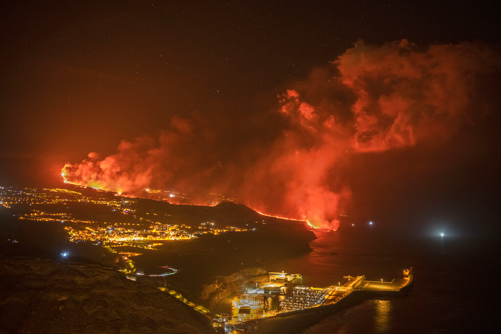Lava from a volcano reaches the sea on the Canary island of La Palma, Spain, Wednesday, Sept. 29, 2021. Lava from a volcano that erupted Sept. 19 on Spain's Canary Islands has finally reached the Atlantic Ocean after wiping out hundreds of homes and forcing the evacuation of thousands of residents. (AP Photo/Saul Santos)