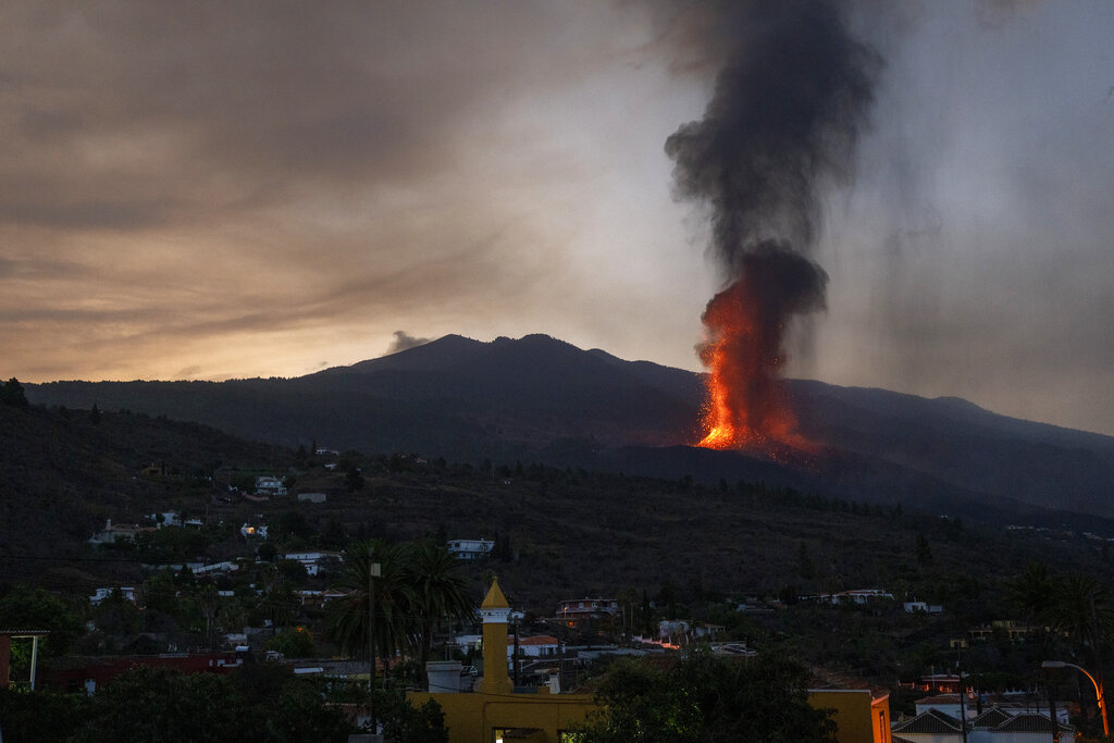 Lava from a volcano eruption flows on the island of La Palma in the Canaries, Spain, Thursday, Sept. 23, 2021. A volcano on a small Spanish island in the Atlantic Ocean erupted on Sunday, forcing the evacuation of thousands of people. Experts say the volcanic eruption and its aftermath on a Spanish island could last for up to 84 days. (AP Photo/Emilio Morenatti)
