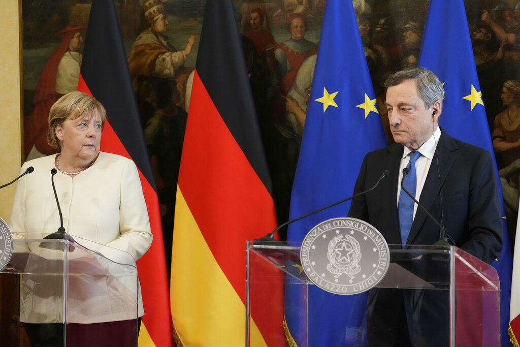 Italian Premier Mario Draghi, right, and German Chancellor Angela Merkel attend a press conference at Palazzo Chigi Premier office, in Rome, Thursday, Oct. 7, 2021. (AP Photo/Andrew Medichini, pool)