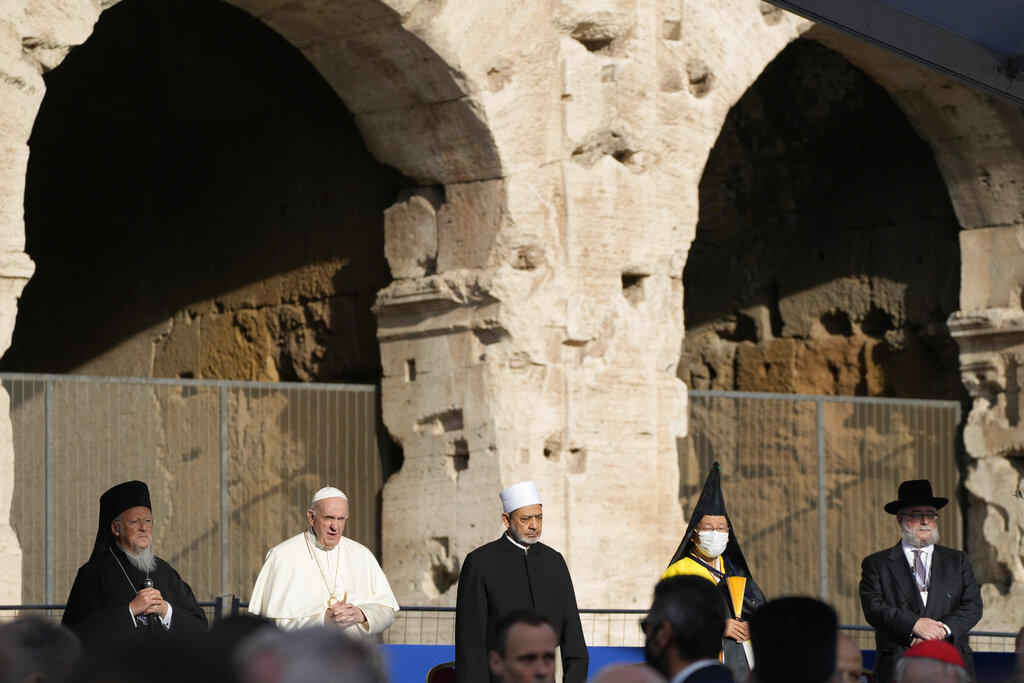 Pope Francis, second from left, is flanked by representatives of different religions as the y preside over a prayer for peace, at the intereligious meeting 'Brother peoples, future land