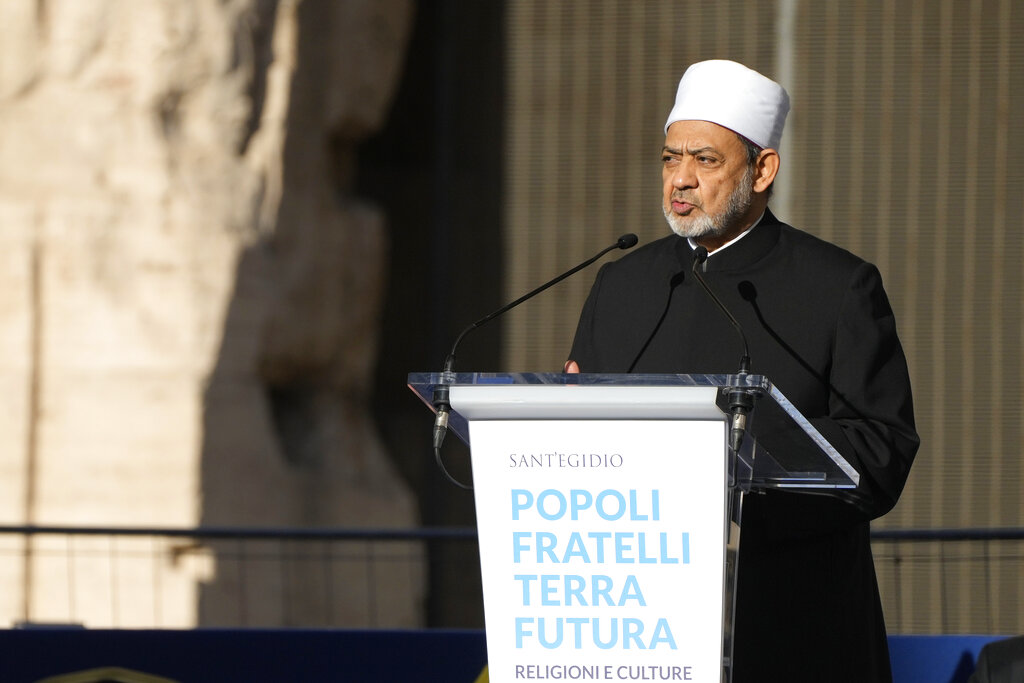 Sheik Ahmed el-Tayyib, Grand Imam of Al-Azhar Mosque, right, delivers his speech at the interreligious meeting 'Brother peoples, future land