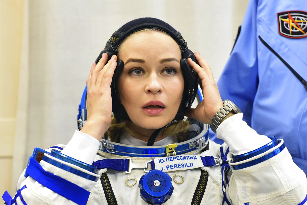 In this photo released by the Roscosmos Space Agency, actress Yulia Peresild looks on prior to the launch to the International Space Station, ISS, at the Russian leased Baikonur cosmodrome, Kazakhstan, Tuesday, Oct. 5, 2021. Actress Yulia Peresild and film director Klim Shipenko blasted off Tuesday for the International Space Station in a Russian Soyuz spacecraft together with cosmonaut Anton Shkaplerov, a veteran of three space missions, to make a feature film in orbit. (Andrey Shelepin, Roscosmos Space Agency via AP)