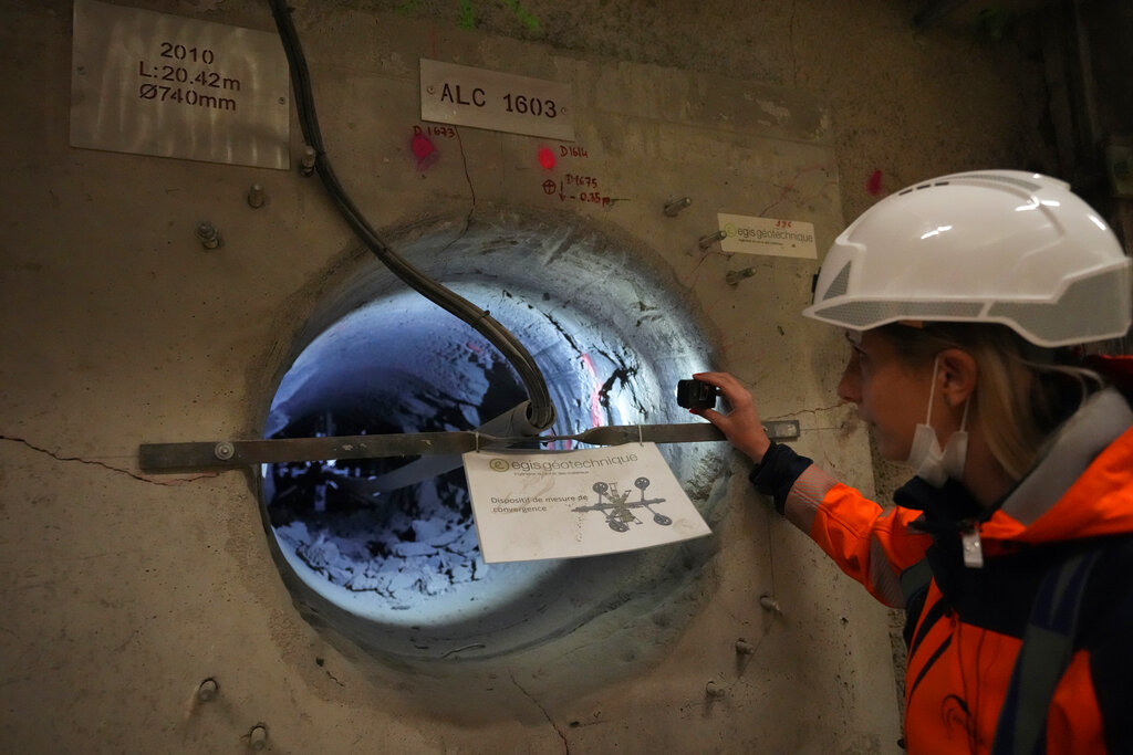 Audrey Guillemenet, geologist and spokesperson, shows a tunnel for radioactive waste in an underground laboratory run by French radioactive waste management agency Andra, in Bure, eastern France, Thursday, Oct. 28, 2021. Nuclear power is a central sticking point as negotiators plot out the world’s future energy strategy at the climate talks in Glasgow, Scotland. (AP Photo/Francois Mori)
