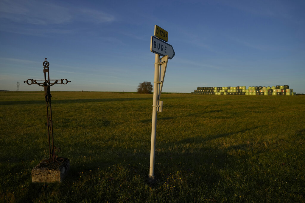 A sign shows the entrance of the village of Bure next to an underground laboratory run by French radioactive waste management agency Andra, in Bure, eastern France, Thursday, Oct. 28, 2021.  (AP Photo/Francois Mori)