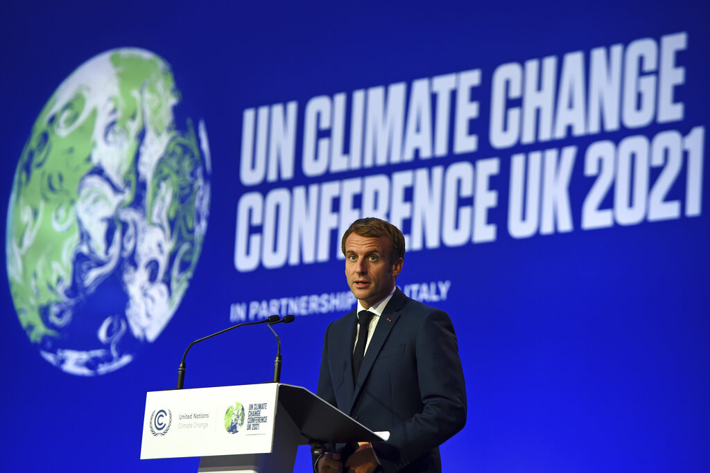 French President Emmanuel Macron speaks during the opening ceremony of the UN Climate Change Conference COP26 in Glasgow, Scotland, Monday Nov. 1, 2021. The U.N. climate summit in Glasgow gathers leaders from around the world, in Scotland's biggest city, to lay out their vision for addressing the common challenge of global warming. (Andy Buchanan/Pool via AP)