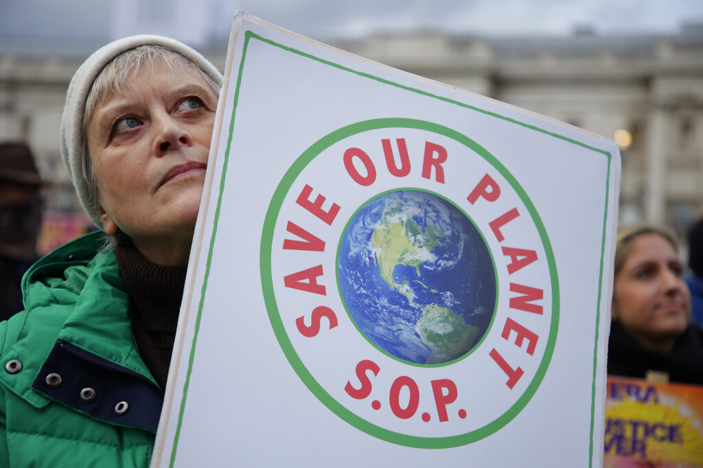 Climate activists gather in Trafalgar Square as they take part in a protest through the streets of London, Saturday, Nov. 6, 2021. Many people across the world are taking part in protests as the first week of the COP26, UN Climate Summit in Glasgow comes to an end. (AP Photo/David Cliff)