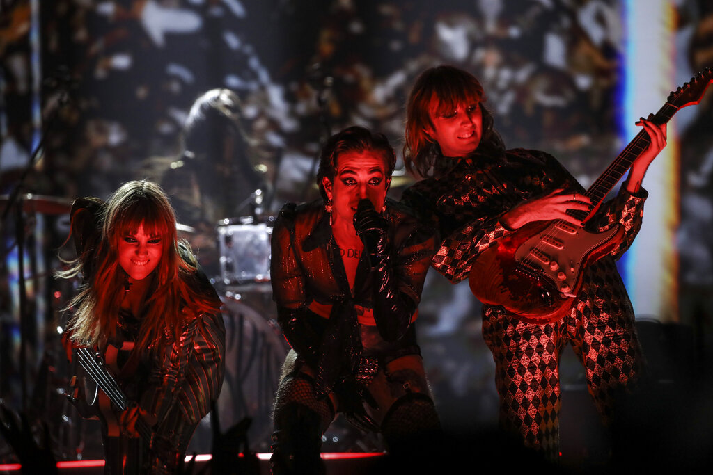 Thomas Raggi, from right, Damiano David, and Victoria De Angelis from the band Maneskin perform at the European MTV Awards in Budapest, Hungary, Sunday, Nov. 14, 2021. (Photo by Vianney Le Caer/Invision/AP)