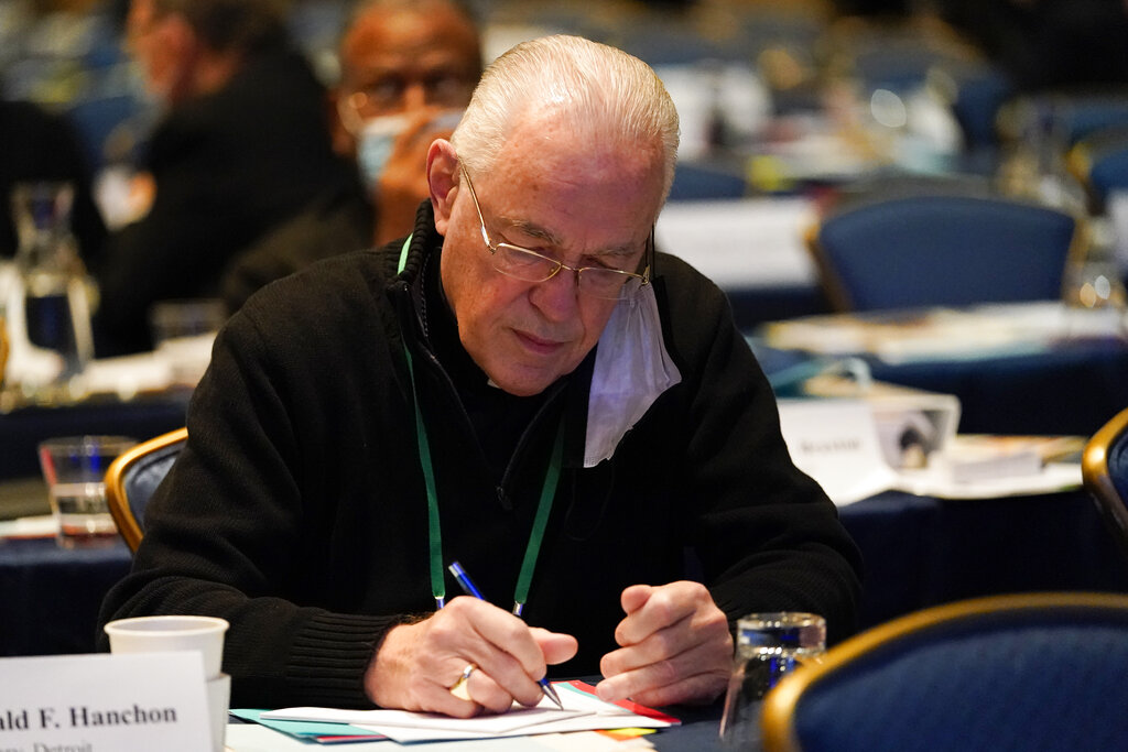 Bishop Donald Hanchon, of Detroit, jots down notes during the Fall General Assembly meeting of the United States Conference of Catholic Bishops, Tuesday, Nov. 16, 2021, in Baltimore.(AP Photo/Julio Cortez)