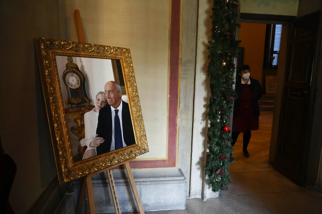 A painting of Prince Nicolo Boncompagni Ludovisi and his wife Princess Rita Boncompagni Ludovisi is displayed inside The Casino dell’Aurora, also known as Villa Ludovisi, in Rome, Tuesday, Nov. 30, 2021. The villa in the heart of Rome that features the only known ceiling painted by Caravaggio is being put up for auction by court order after the home was restored by its last occupants: a Texas-born princess and her late husband, a member of one of Rome’s aristocratic families. (AP Photo/Gregorio Borgia)