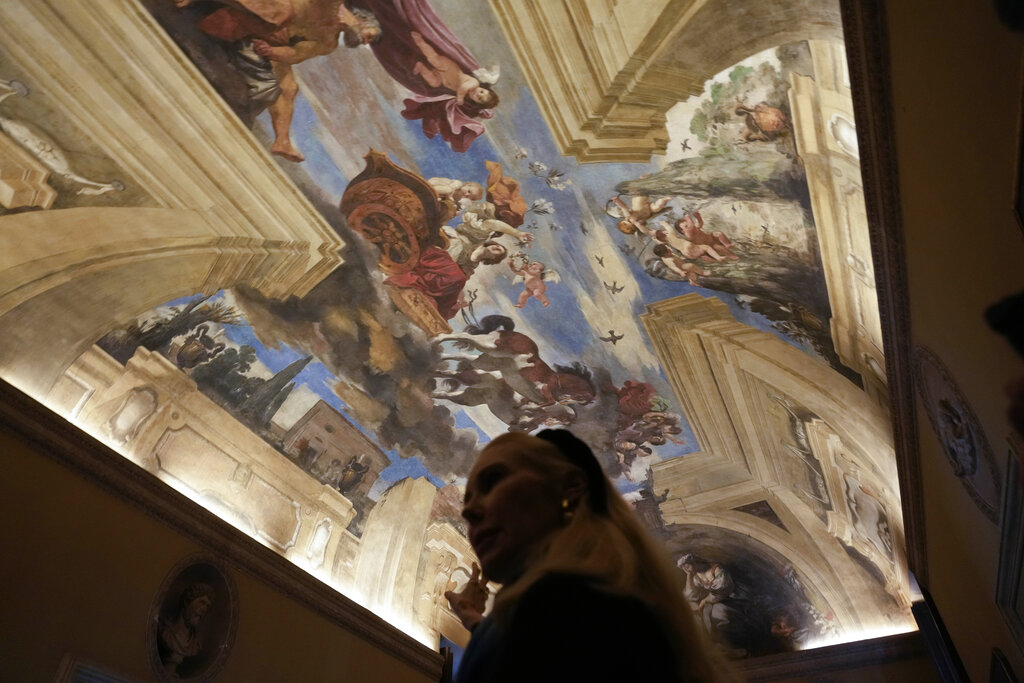 Princess Rita Boncompagni Ludovisi shows a fresco by Guercino inside The Casino dell’Aurora, also known as Villa Ludovisi, in Rome, Tuesday, Nov. 30, 2021. The villa in the heart of Rome that features the only known ceiling painted by Caravaggio is being put up for auction by court order after the home was restored by its last occupants: a Texas-born princess and her late husband, a member of one of Rome’s aristocratic families. (AP Photo/Gregorio Borgia)