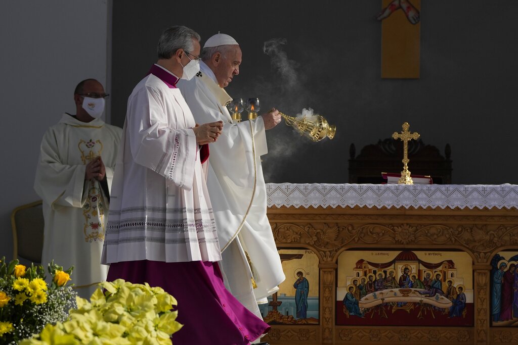 Pope Francis leads a holy mass at GSP stadium in Nicosia, Cyprus, Friday, Dec. 3, 2021. Francis is on a five-day trip to Cyprus and Greece by drawing attention once again to his call for Europe to welcome migrants. (AP Photo/Alessandra Tarantino)