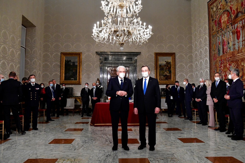 Italy's President Sergio Mattarella, left, and Italy's Prime Minister Mario Draghi pose for a photograph at the Quirinale presidential palace in Rome, Friday, Nov. 26, 2021. (Alberto Pizzoli / Pool photo via AP)