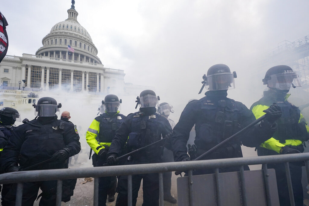 Washington Metropolitan Police department officers assist U.S. Capitol Police with rioters on the West Front of the U.S. Capitol on Jan. 6, 2021, in Washington. (AP Photo/Julio Cortez)