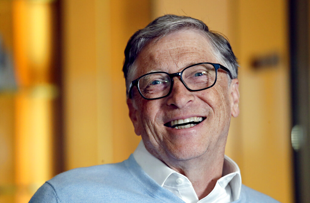 FILE - In this Feb. 1, 2019, file photo, Bill Gates smiles while being interviewed in Kirkland, Wash. Washington state's richest residents, including Gates and Jeff Bezos, would pay a wealth tax on certain financial assets worth more than $1 billion under a proposed bill whose sponsor says she is seeking a fair and equitable tax code. Under the bill, starting Jan. 1, 2022, for taxes due in 2023, a 1% tax would be levied not on income, but on 
