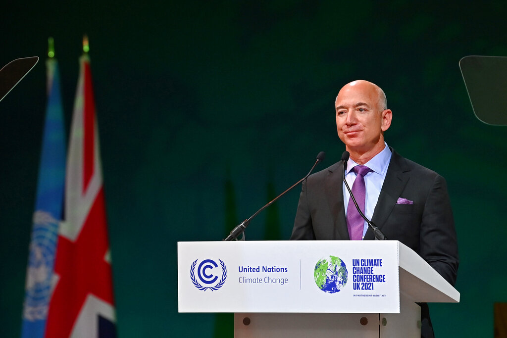 CEO of Amazon Jeff Bezos delivers his message during a session on Action on Forests and Land Use, during the UN Climate Change Conference COP26 in Glasgow, Scotland, Tuesday, Nov. 2, 2021. (Paul Ellis/Pool Photo via AP)