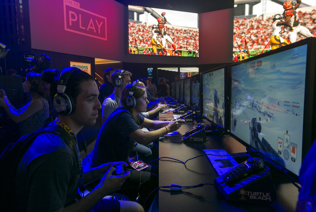 FILE - In this June 16, 2015 file photo, attendees play Electronic Arts'  