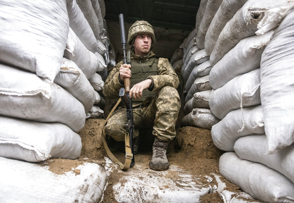 A Ukrainian soldier in the trench on the line of separation from pro-Russian rebels, Mariupol, Donetsk region, Ukraine, Friday, Jan. 21, 2022. Blinken said the U.S. would be open to a meeting between Putin and U.S. President Joe Biden, if it would be “useful and productive.” The two have met once in person in Geneva and have had several virtual conversations on Ukraine that have proven largely inconclusive. Washington and its allies have repeatedly promised consequences such as biting economic sanctions against Russia — though not military action — if it invades. (AP Photo/Andriy Dubchak)