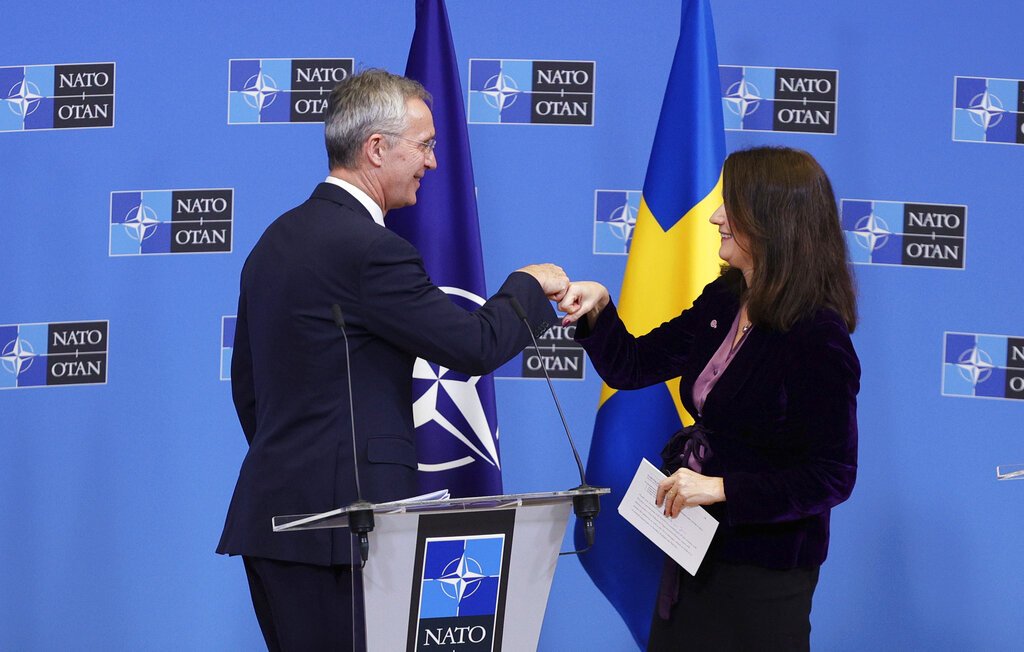 NATO Secretary General Jens Stoltenberg, left, greets Sweden's Foreign Minister Ann Linde at the end of a media conference at NATO headquarters in Brussels, Monday, Jan. 24, 2022. (AP Photo/Olivier Matthys)