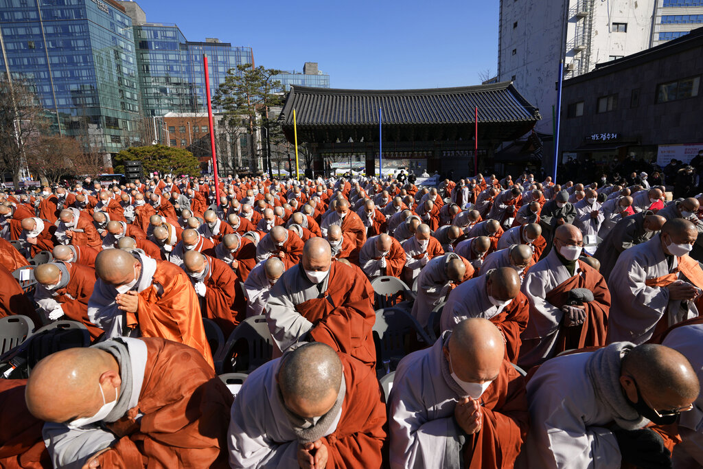 South Korean Buddhist monks participate at a rally at the Jogye temple in Seoul, South Korea, Friday, Jan. 21, 2022. Thousands of Buddhist monks gathered to protest alleged religious discrimination by South Korean government. (AP Photo/Lee Jin-man)