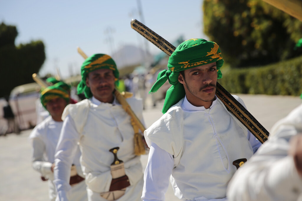 Yemeni grooms dressed in traditional attire attend a mass wedding, held by the Houthis for thousands of couples in Sanaa, Yemen, Thursday, Dec. 2, 2021. (AP Photo/Hani Mohammed)