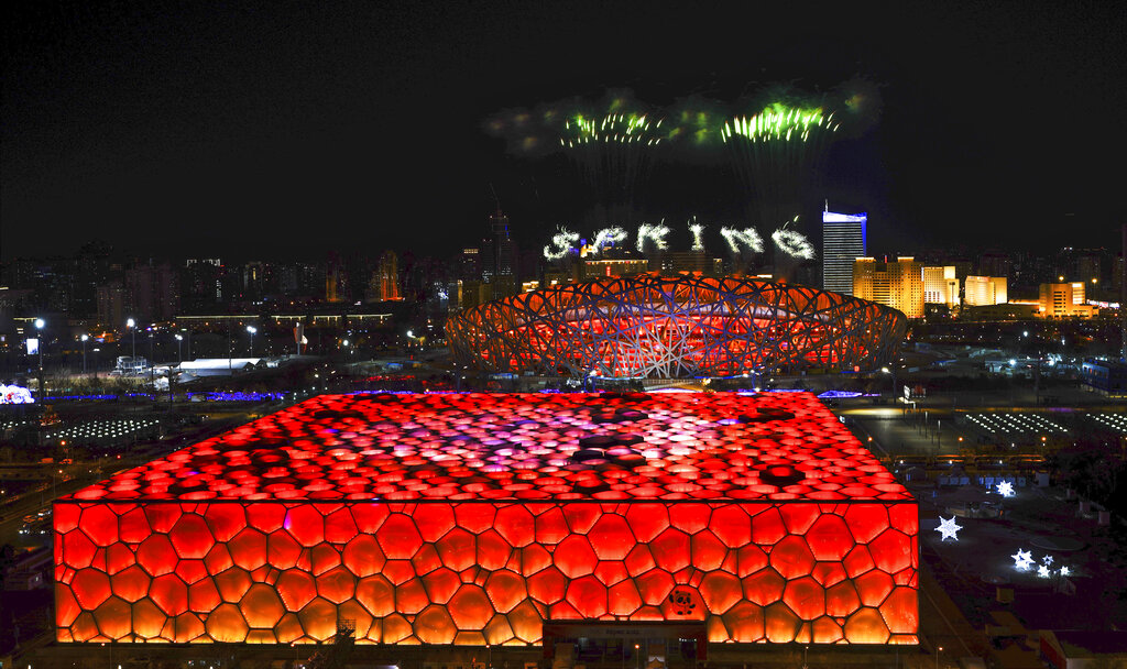 Fireworks illuminate the night sky during the opening ceremony of the 2022 Winter Olympics, Friday, Feb. 4, 2022, in Beijing.  (Xing Guangli/Pool Photo via AP)