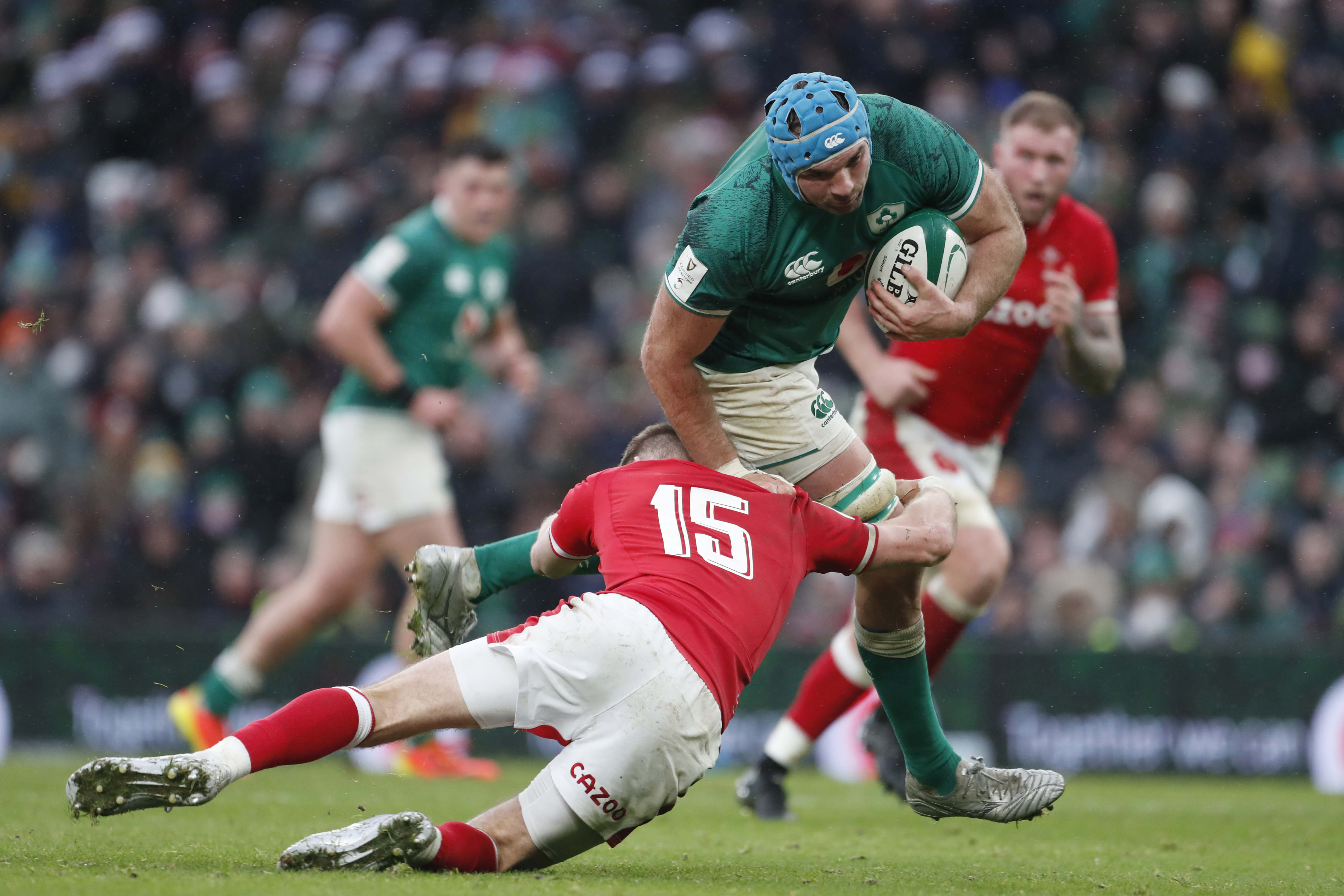 Ireland's Tadhg Beirne is tackled by Wales' Liam Williams during the Six Nations rugby union match between Ireland and Wales at the Aviva stadium in Dublin, Ireland, Saturday, Feb. 5, 2022. Ireland defeated Wales 29-7.(AP Photo/Peter Morrison)
